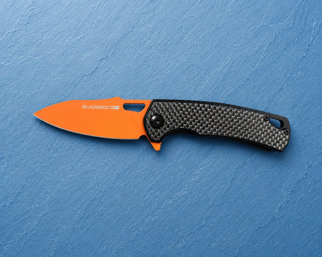 Premium D2 Steel • Carbon Fiber Handle • Brand New in Box • Orange Blade